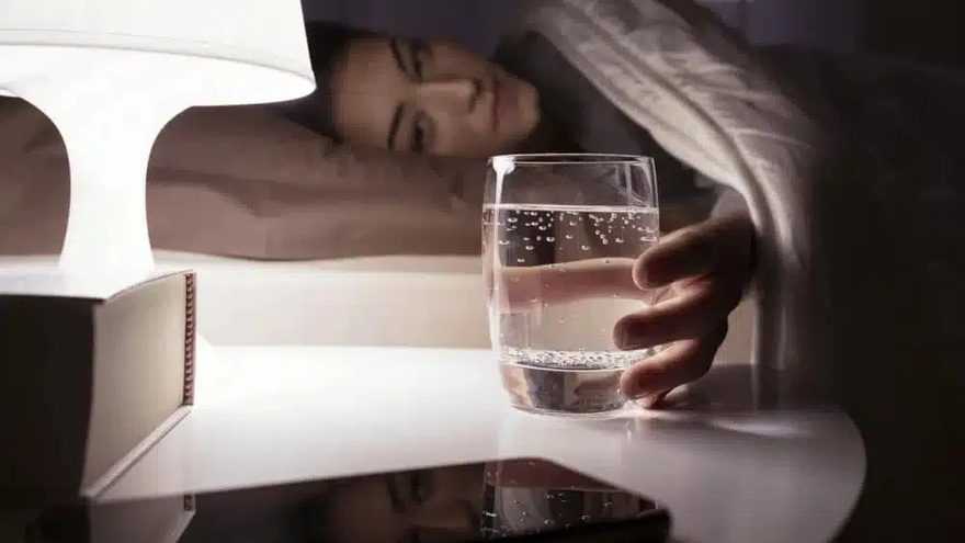 Why should you put a glass of water on your nightstand?