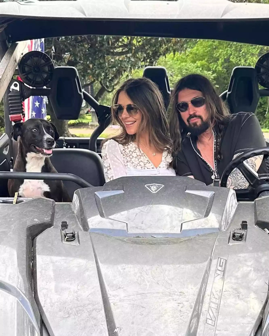 Billy Ray Cyrus and Elizabeth Hurley’s Surprise Romance Heats Up with Passionate Kiss in Latest Photo